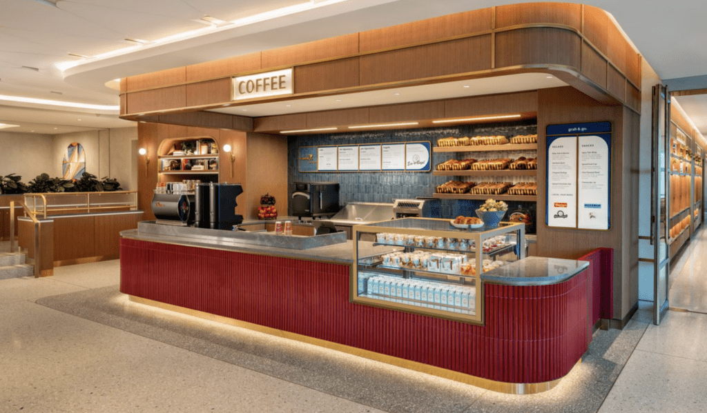a coffee shop with a counter and shelves
